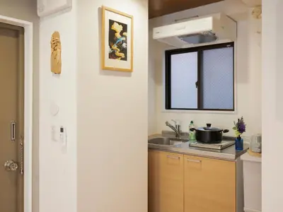 a kitchen with a sink and a stove and a window at \u685c\u306e\u5ddd73 \u521d\u53f0\u99c55\u5206 2-4\u4eba\u4e285 minute from Hatsudai 2-4 people in Tokyo