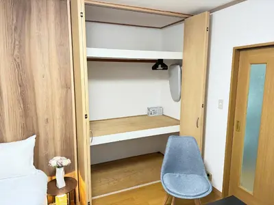 a small room with a bed and a chair at Shinjuku Area 302 Shinjuku Apartment in Tokyo