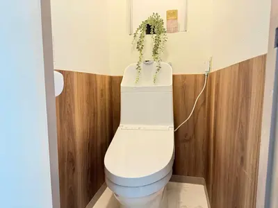 a bathroom with a toilet with a plant on it at Shinjuku Area 302 Shinjuku Apartment in Tokyo