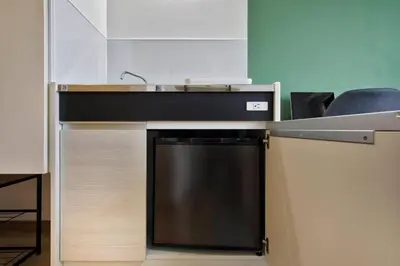 a kitchen counter with a sink and a dishwasher at CraftFlat Komagome 503, a compact studio at excellent location in Tokyo