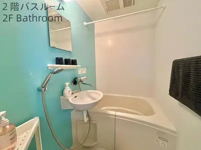 a bathroom with a sink and a bath tub at \u5357\u516c\u5712\u30b9\u30ab\u30a4\u30d3\u30e5\u30fc in Tokyo