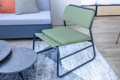 a chair and a table next to a couch at \u30b7\u30c6\u30a3\u30c6\u30e9\u30b9\u8d64\u5742 in Tokyo