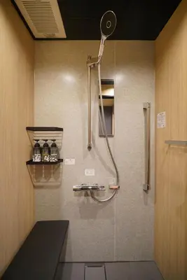 a bathroom with a shower with a shower head at LinksHotel\u4e0a\u91ce in Tokyo