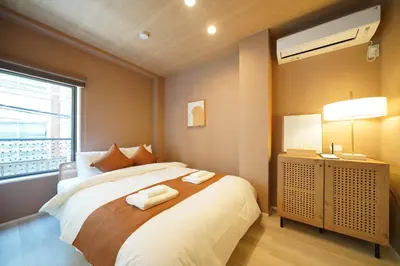 a bedroom with a bed with two towels on it at LinksHotel\u4e0a\u91ce in Tokyo