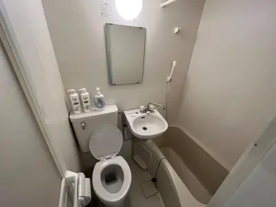 a small bathroom with a toilet and a sink at Shinjuku 5 min, Nakano station 1 min walk, 101 in Tokyo