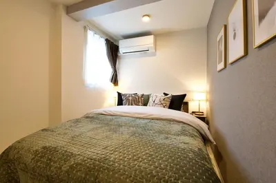 a bedroom with a bed and a window at 1 stop to Ikebukuro 3 min walk from station in Tokyo