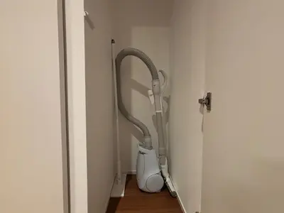 a vacuum cleaner in a corner of a room at PRISM Inn Kagurazaka in Tokyo
