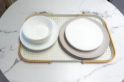 a tray with plates and bowls on a table at Beige Frame in Tokyo