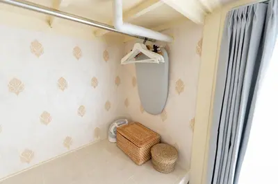 a bathroom with a toilet and a window at Beige Frame in Tokyo