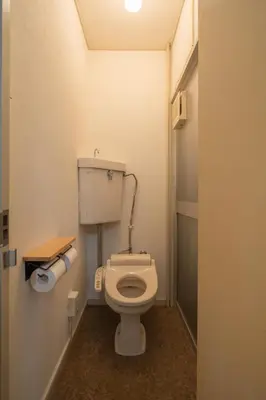 a bathroom with a white toilet in a room at 15 min Ikebukuro Tokyo 2-BR Apartment in Tokyo