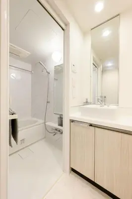 a white bathroom with a tub and a sink at アルファサイト御茶ノ水 - Historic Ochanomizu Stay - Near Akihabara & Imperial Palace - JR & Subway Access in Tokyo