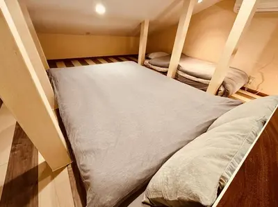 a small room with two bunk beds in it at Villa Ōyama in Tokyo