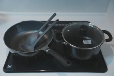a pan and utensils sitting on top of a stove at Dorothy Inn Spacious 4LDK New Build 97sqm Up to 10 Guests Free Private Parking Near JR Higashi Jujo Station 3 Minute Walk in Tokyo