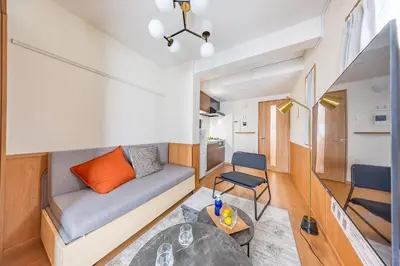 a small living room with a couch and a table at \u30e2\u30f3 \u30b7\u30e3\u30c8\u30fc\u4e2d\u91ce\u5e73\u548c\u306e\u68ee in Tokyo