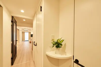 a bathroom with a sink and a plant on a counter at LIVECASA\u8535\u524d 2mins to Kuramae station in Tokyo