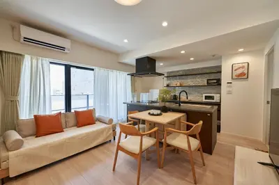 a living room with a couch and a table at LIVECASA\u8535\u524d 2mins to Kuramae station in Tokyo