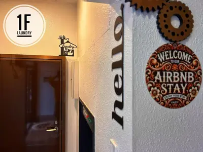 a sign on a wall next to an entrance to an elevator at 磐-Comfortable Home with 2BR-Sleeps 6 in Kagurazaka Near Yayoi Kusama Museum , Tokyo Dome , Sakura Lovers' Choice-Kanda River in Tokyo