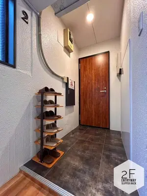 a hallway with a door and a shelf of shoes at 磐-Comfortable Home with 2BR-Sleeps 6 in Kagurazaka Near Yayoi Kusama Museum , Tokyo Dome , Sakura Lovers' Choice-Kanda River in Tokyo