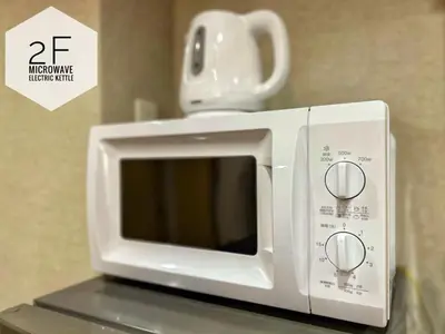 a white microwave oven sitting on top of a counter at 磐-Comfortable Home with 2BR-Sleeps 6 in Kagurazaka Near Yayoi Kusama Museum , Tokyo Dome , Sakura Lovers' Choice-Kanda River in Tokyo