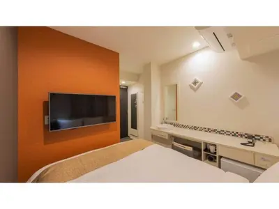 a hotel room with a bed and a flat screen tv at ASTA HOTEL - Vacation STAY 87220v in Tokyo