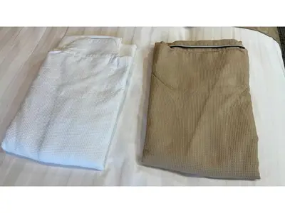 a pair of shorts sitting on top of a bed at ASTA HOTEL - Vacation STAY 87233v in Tokyo