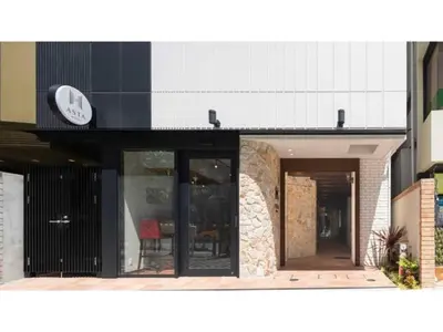 a building with a clock on the side of it at ASTA HOTEL - Vacation STAY 87287v in Tokyo