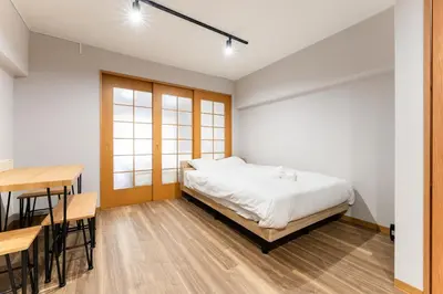 a bedroom with a bed and a table and a desk at Ohana's room Walk to Shibuya station by 8 minutes private apartment studio Max6 in Tokyo