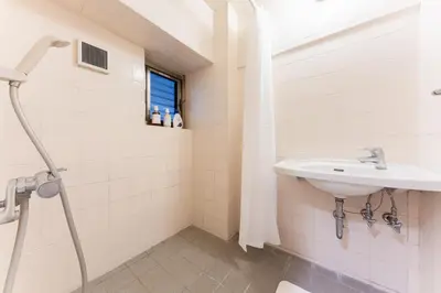 a white bathroom with a sink and a shower at Ohana's room Walk to Shibuya station by 8 minutes private apartment studio Max6 in Tokyo