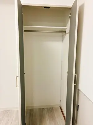 a closet with a white door in a room at \u6696\u71c8 DANTO inn 2F in Tokyo