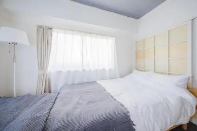 a white bedroom with a large bed and a window at Comfy Stay Tokiwadai 2minute walk from Tokiwadai Station Ikebukuro 9min Shinjuku 14min Shibuya 18min Max 4guests Many restaurants nearby hot spring Shrine nearby in Tokyo