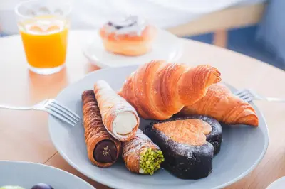 a plate of pastries and croissants on a table at Comfy Stay Tokiwadai 2minute walk from Tokiwadai Station Ikebukuro 9min Shinjuku 14min Shibuya 18min Max 4guests Many restaurants nearby hot spring Shrine nearby in Tokyo