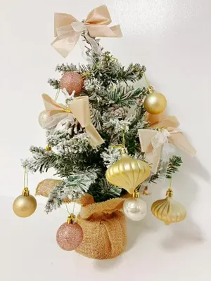 a christmas tree with ornaments on top of it at \u6696\u71c8 DANTO inn 1F in Tokyo