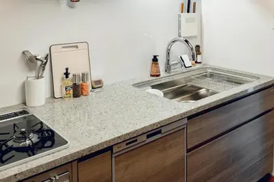 a kitchen with a sink and a counter top at ACOE FUYU HATSUDAI - Re-design 2BR Modish Home in Shinjuku in Tokyo
