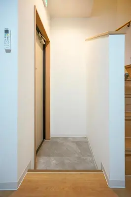 a hallway with a white wall and a door at BT House Nakano3-3min Shinjuku 15min Shibuya-Modern 2BR-Convenient access to airports in Tokyo