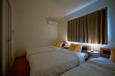a hotel room with two beds and a window at BT House Nakano3-3min Shinjuku 15min Shibuya-Modern 2BR-Convenient access to airports in Tokyo