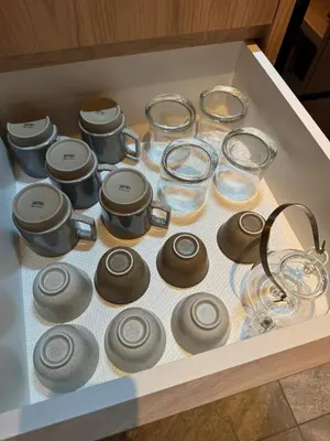 a drawer filled with glasses and pots and pans at sumica\u6d45\u8349\u82b1\u9ce5 in Tokyo