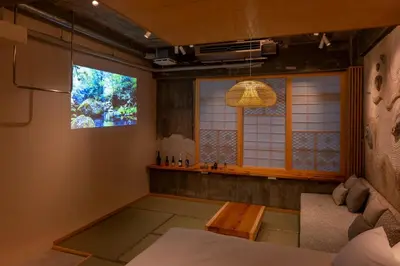 a living room with a couch and a tv at sumica\u6d45\u8349\u82b1\u9ce5 in Tokyo