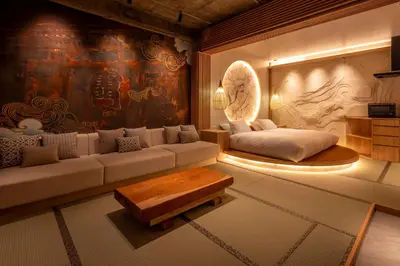a living room with a couch and a table at sumica\u98a8\u6708\u6d45\u8349 in Tokyo