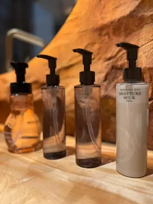 a group of three bottles sitting on a table at sumica\u98a8\u6708\u6d45\u8349 in Tokyo