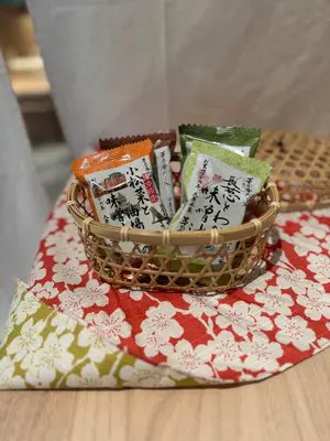a basket filled with books on top of a table at sumica\u98a8\u6708\u6d45\u8349 in Tokyo