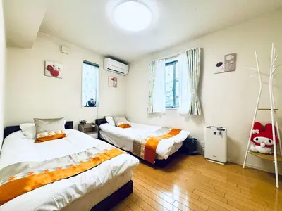 a bedroom with two beds and a window at XH-Ōgi, Adachi City 足立2dk-AD0042 in Tokyo