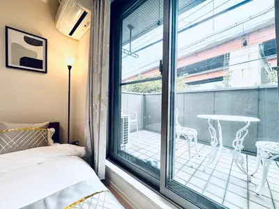 a bedroom with a bed and a large window at XH-Ōgi, Adachi City 足立2dk-AD0042 in Tokyo