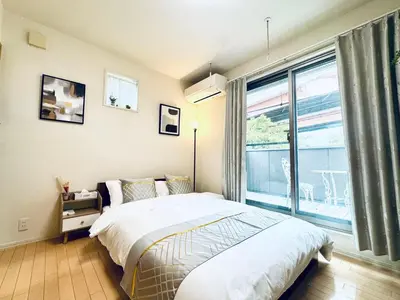 a bedroom with a bed and a large window at XH-Ōgi, Adachi City 足立2dk-AD0042 in Tokyo