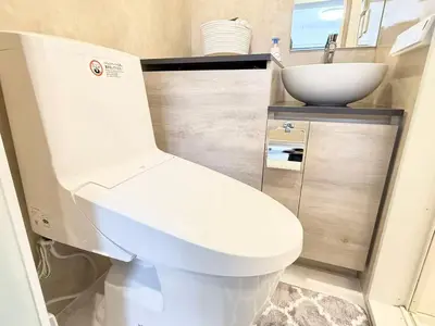 a bathroom with a white toilet and a sink at Shinjuku downtown b3 in Tokyo