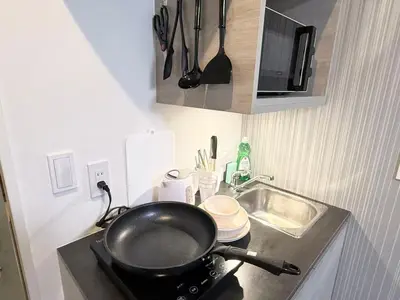 a frying pan on top of a stove in a kitchen at Shinjuku downtown b3 in Tokyo