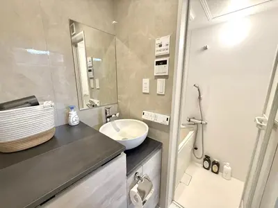 a small bathroom with a sink and a mirror at Shinjuku downtown b3 in Tokyo