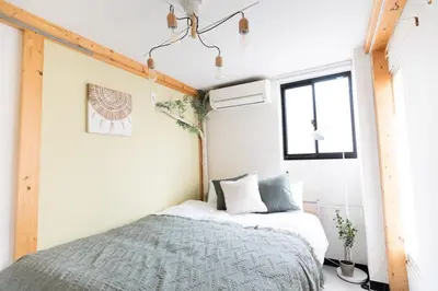 a bedroom with a bed and a window at Perfect Tokyo Location-Gueat for Sightseeing,SIeeps up to8! in Tokyo