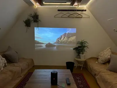 a living room with a large painting on the wall at Perfect Tokyo Location-Gueat for Sightseeing,SIeeps up to8! in Tokyo