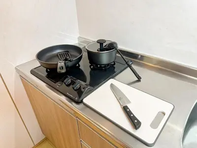 a pot and a pan on a stove on a counter at Spacious 2BR TownHouse, Central Shinjuku City in Tokyo