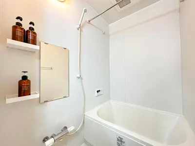a white bathroom with a tub and a shower at Spacious 2BR TownHouse, Central Shinjuku City in Tokyo